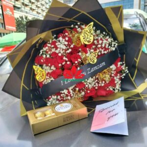 Red roses, gypsophila bouquet and ferrero chocolate